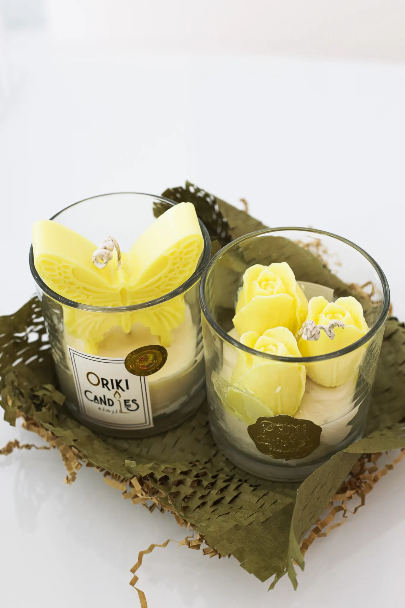 Soul Love and Oriki Candles custom artisan candles featuring sculpted butterfly and yellow rose designs