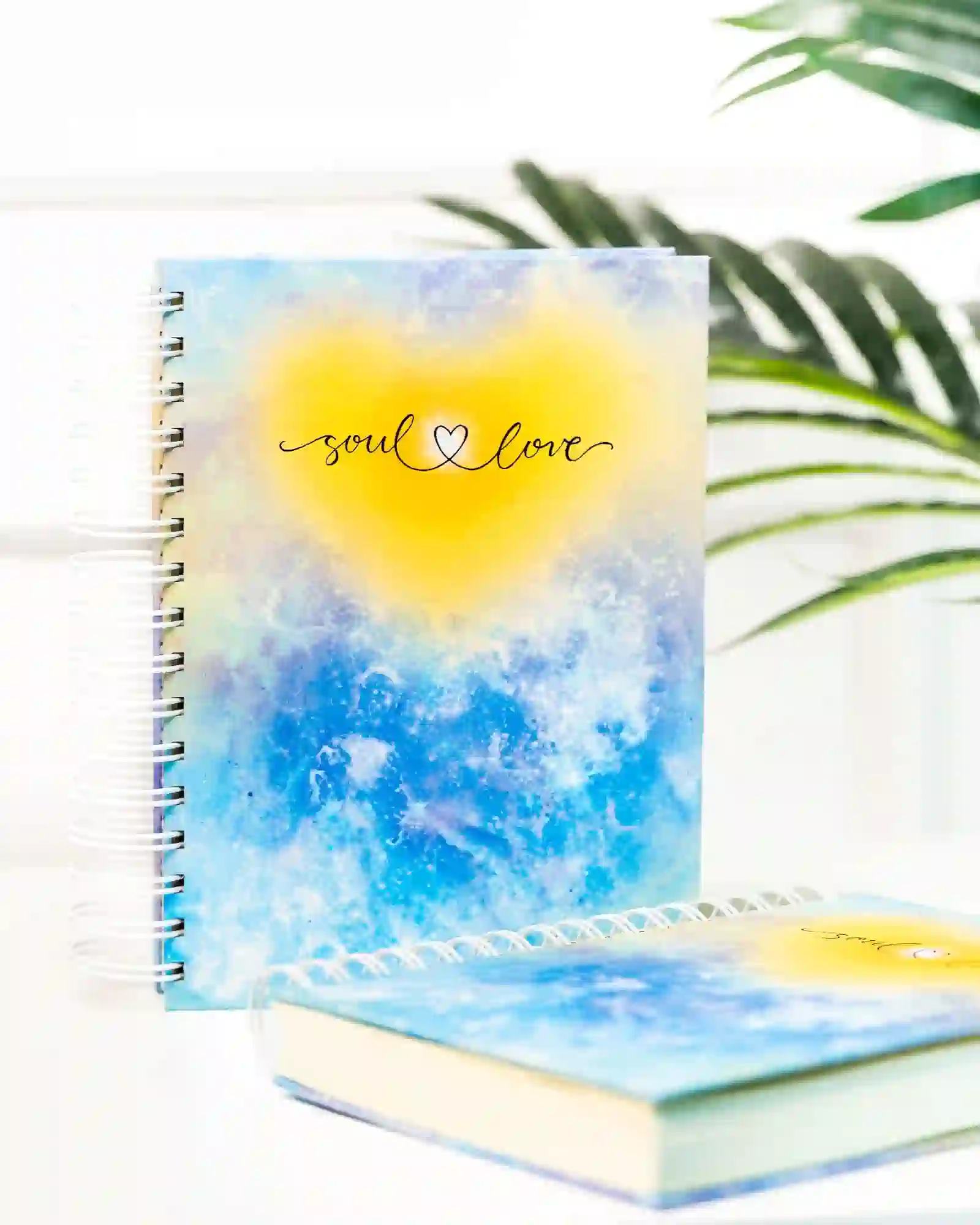 The Soul Love Journal beside a second blue journal